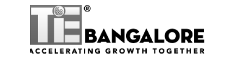 TiE logo featuring bold "TiE" lettering with a globe icon inside the letter "i"-Neutrinos